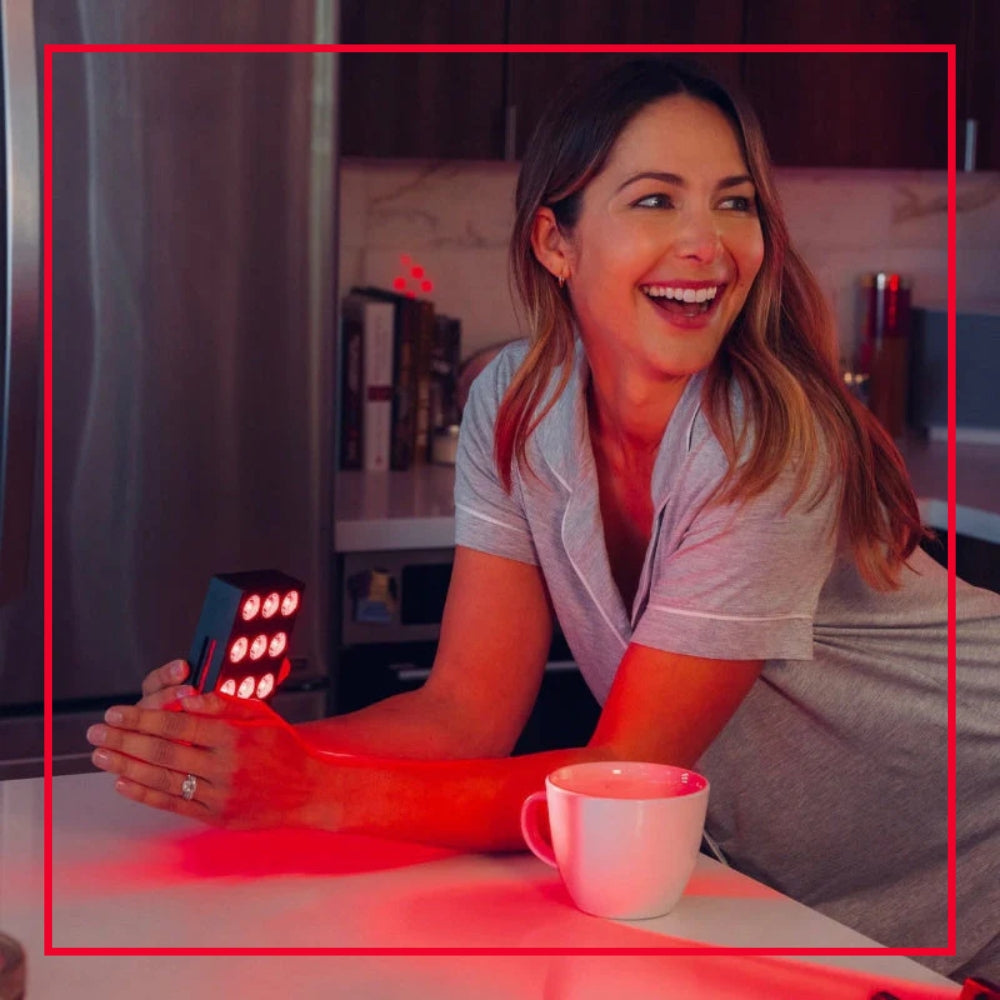 Woman using a home panel in her kitchen