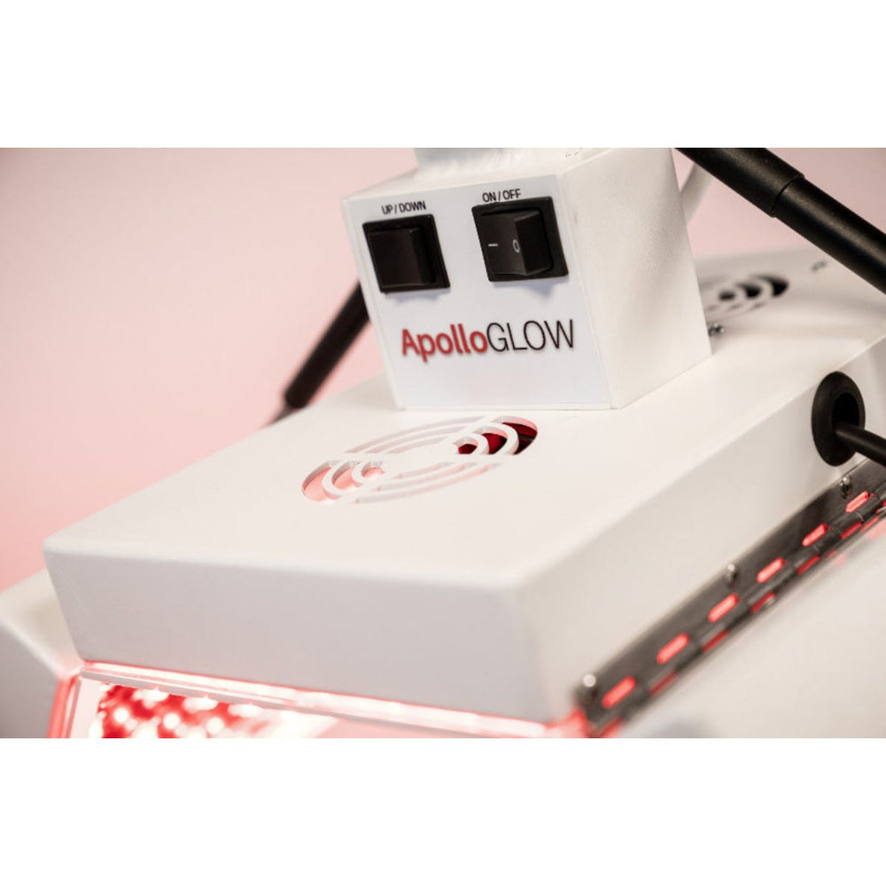 ApolloGLOW device with red light therapy on a pink background