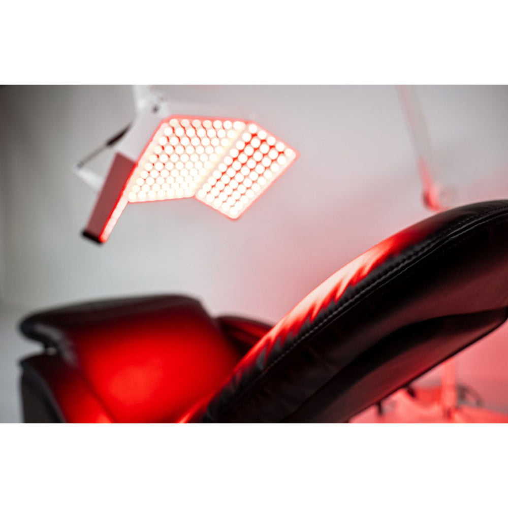 Close-up of a red LED light panel on a white background
