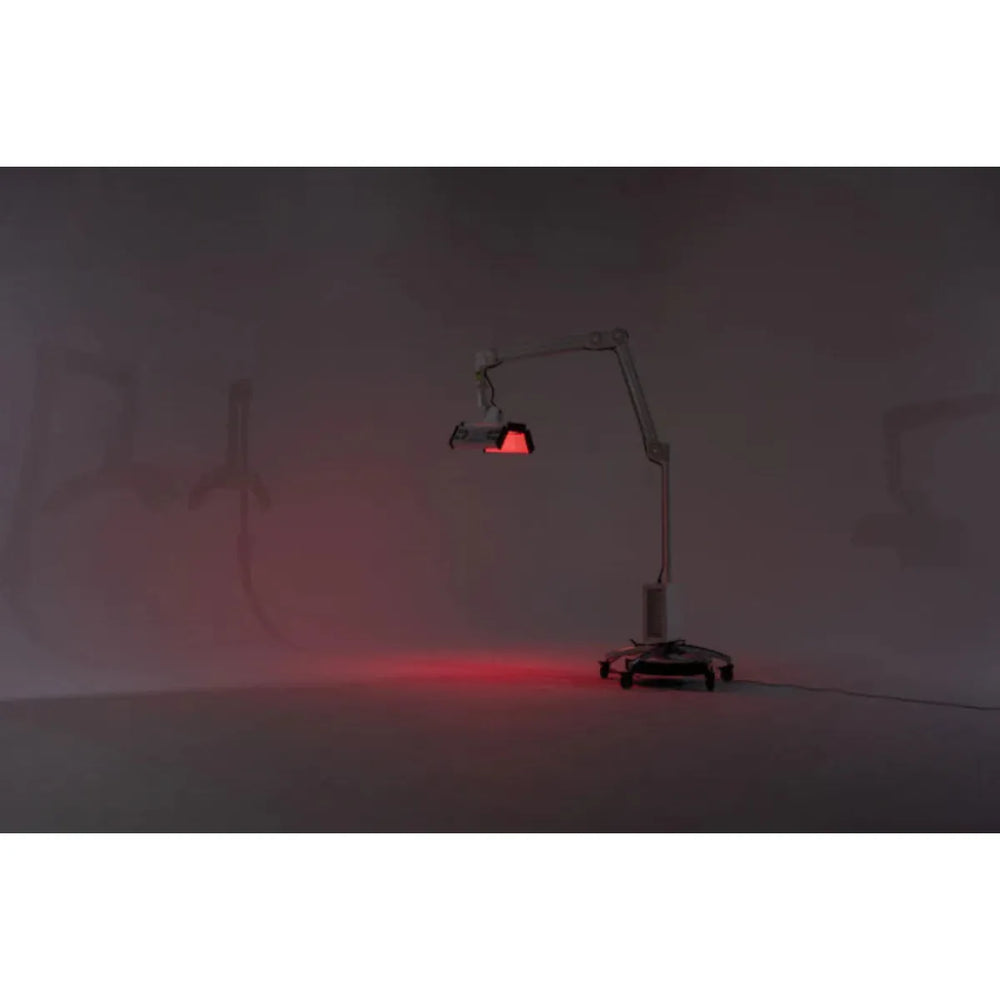 Red light lamp on a stand in a dark room