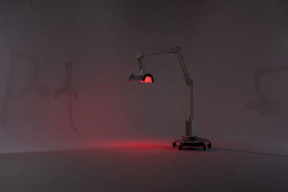 Red light lamp on a stand in a dark room