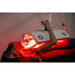 Person receiving red light therapy treatment using a panel.