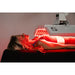 Person receiving red light therapy treatment with a machine.