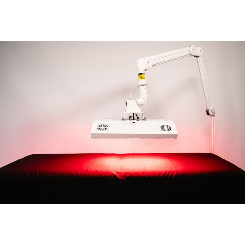 Red light therapy device on a table with a neutral background