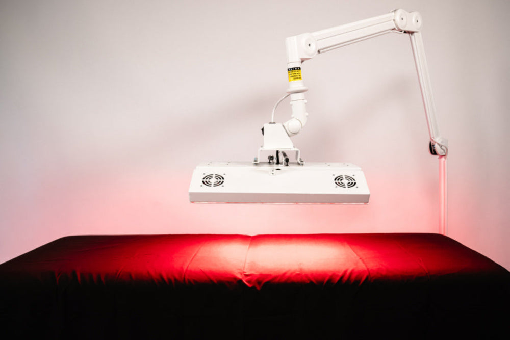 Red light therapy device on a table with a neutral background