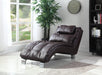 Brown leather chaise lounge in a room with a large window, plant, and clock.