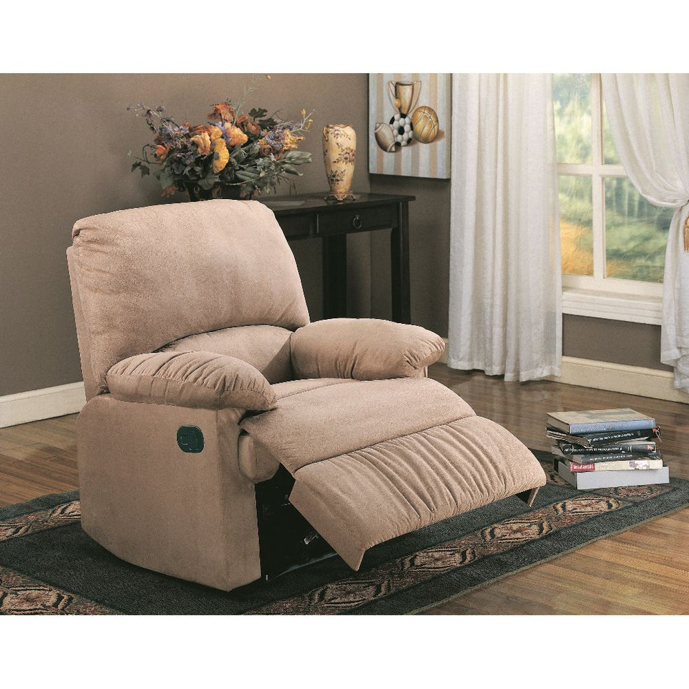 Beige recliner chair in a living room setting with a table and window in the background.