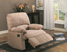 Beige recliner chair in a living room setting with a table and window in the background.