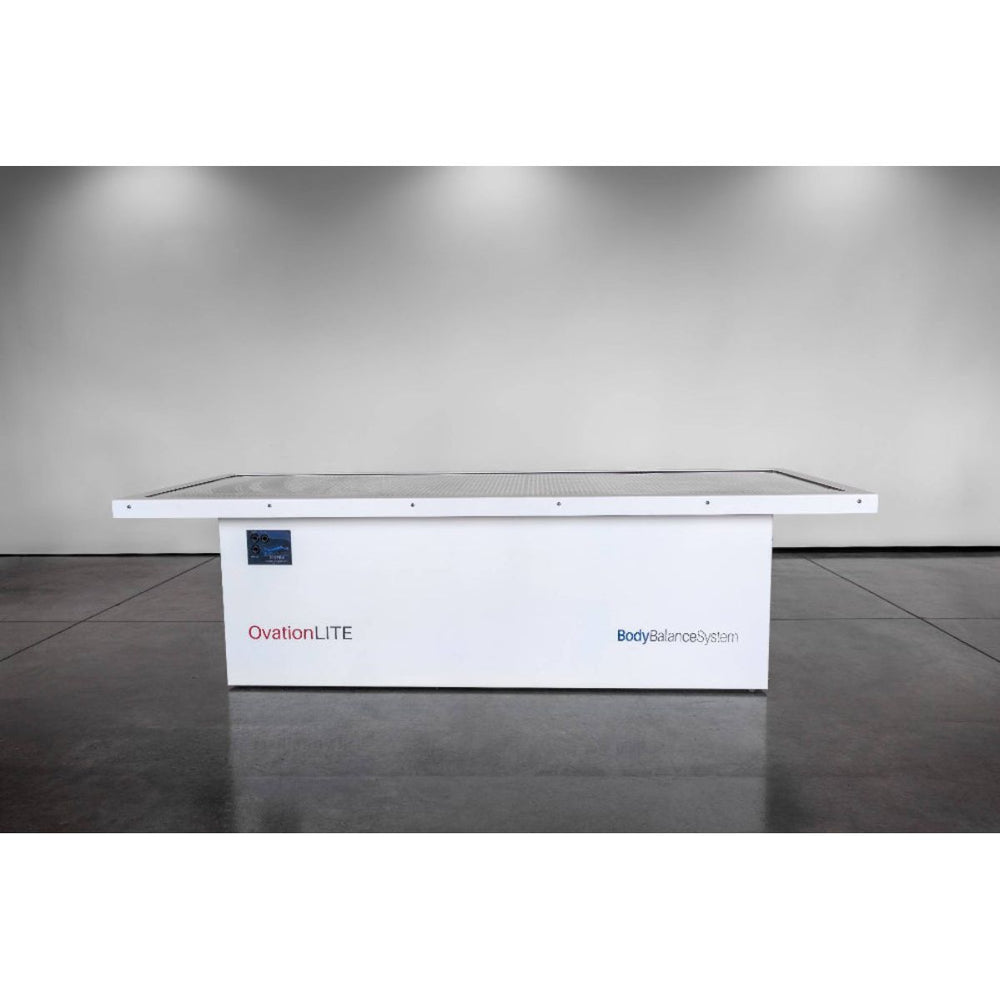 White red light table with 'OvationLITE' branding on a gray floor.