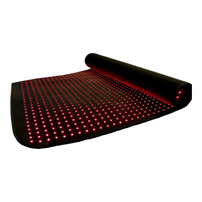 Roll of LED strip lights with red LEDs on a white background