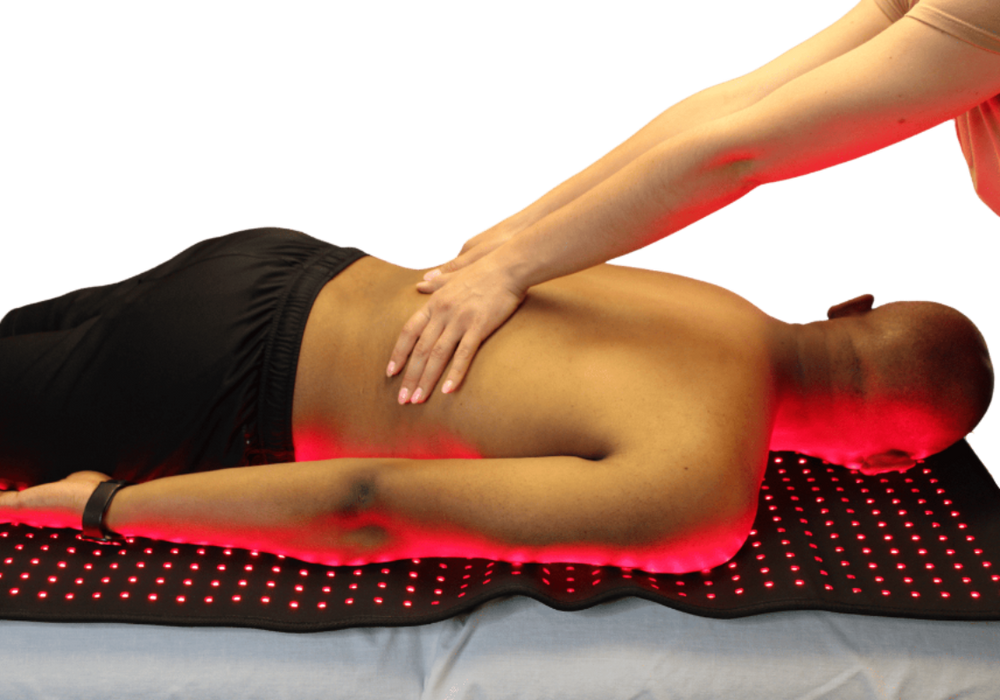 Man on a prism light pad receiving a massage