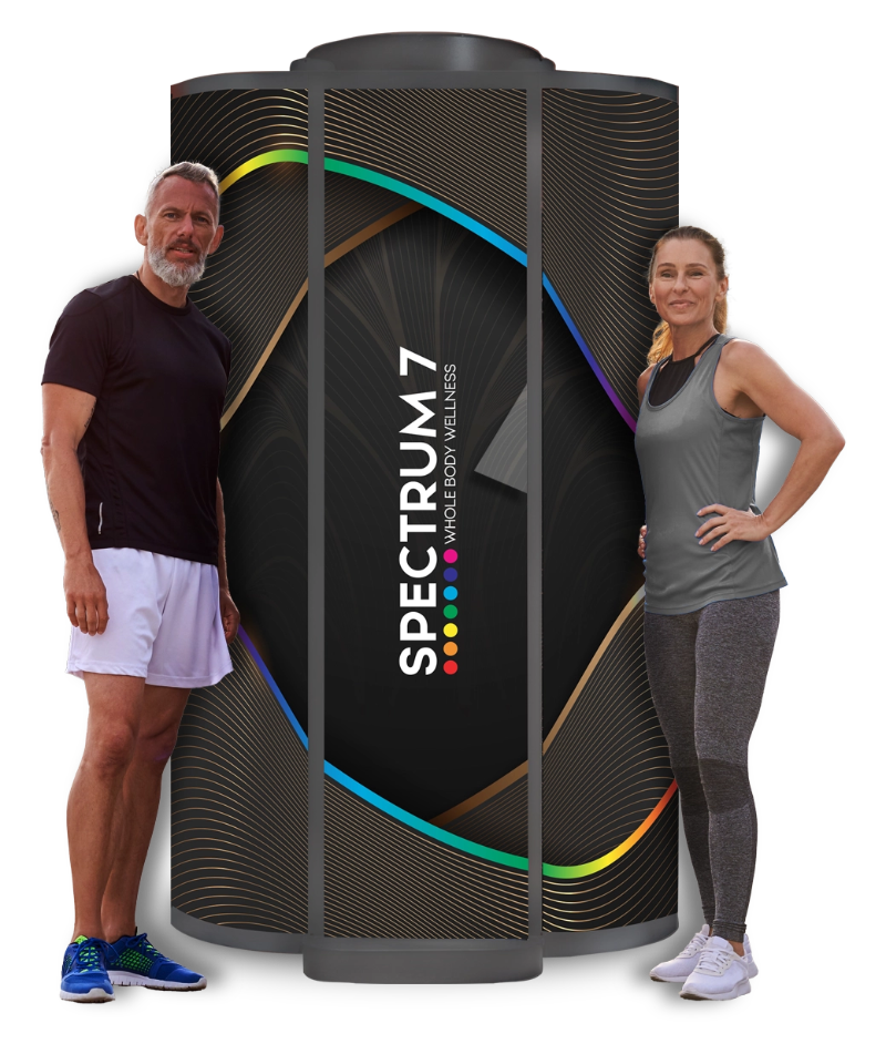 Two people standing next to a large 'Spectrum 7' product on a white background