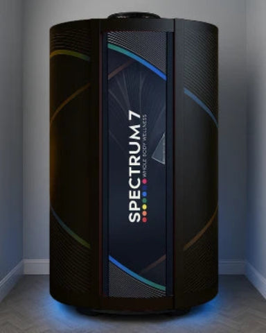 Spectrum 7 device in a room with a dark background