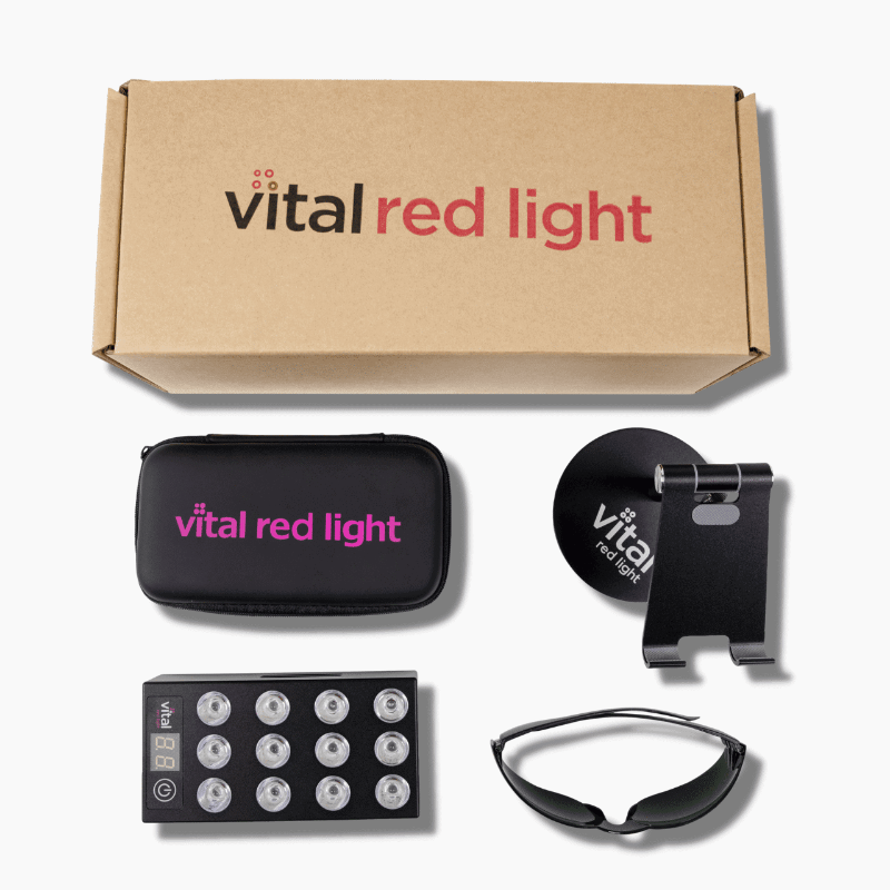 Collection of 'vital red light' products including a box, pouch, remote control, and other accessories on a white background.